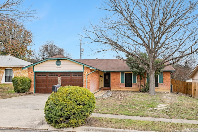 ranch-style house featuring a garage