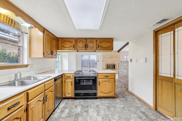 kitchen featuring black range oven, dishwasher, sink, kitchen peninsula, and a textured ceiling