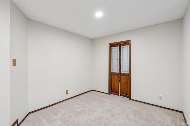 empty room featuring light colored carpet