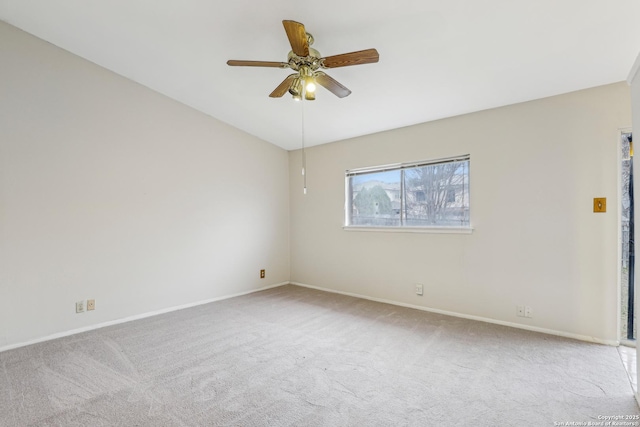 spare room featuring light colored carpet and ceiling fan