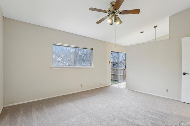 empty room with light colored carpet and ceiling fan