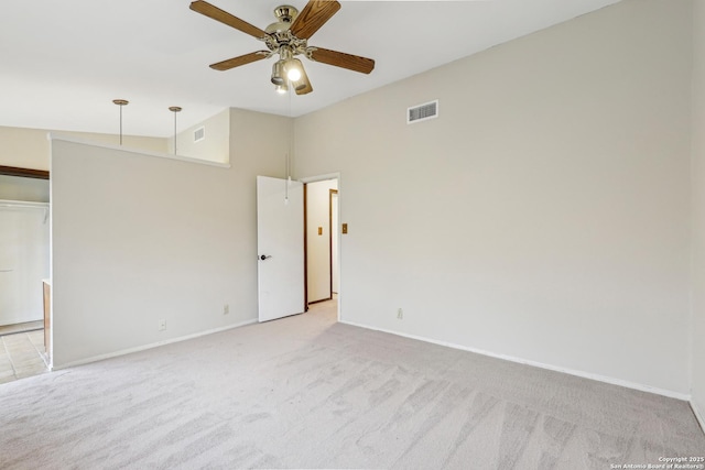 carpeted empty room featuring ceiling fan