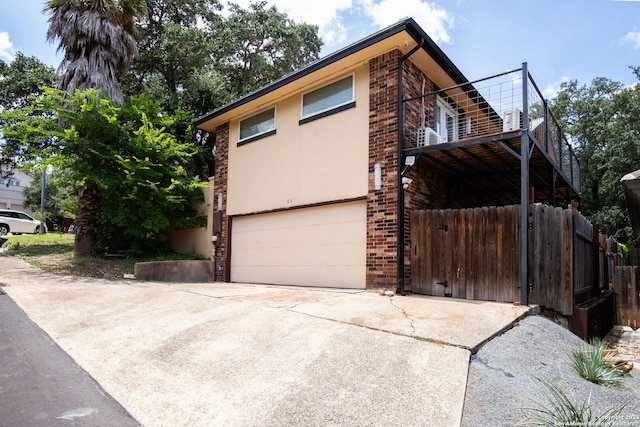 view of side of home with a garage