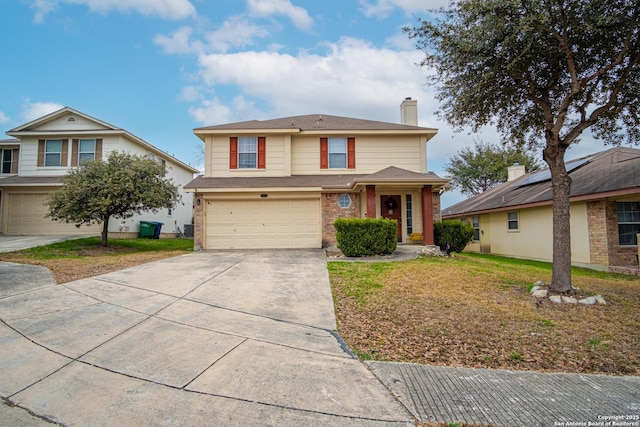 view of front property featuring a garage and a front lawn