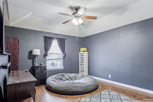 bedroom featuring hardwood / wood-style floors and ceiling fan