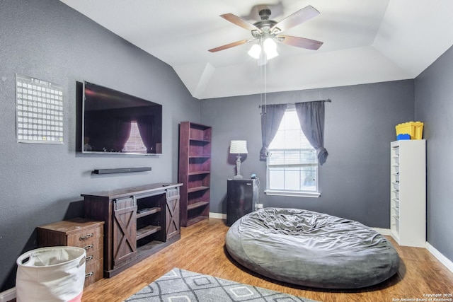 sitting room featuring vaulted ceiling, ceiling fan, and light hardwood / wood-style flooring