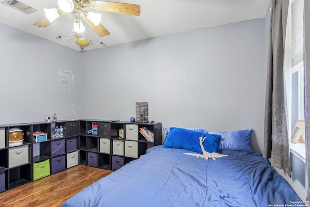 bedroom featuring wood-type flooring and ceiling fan