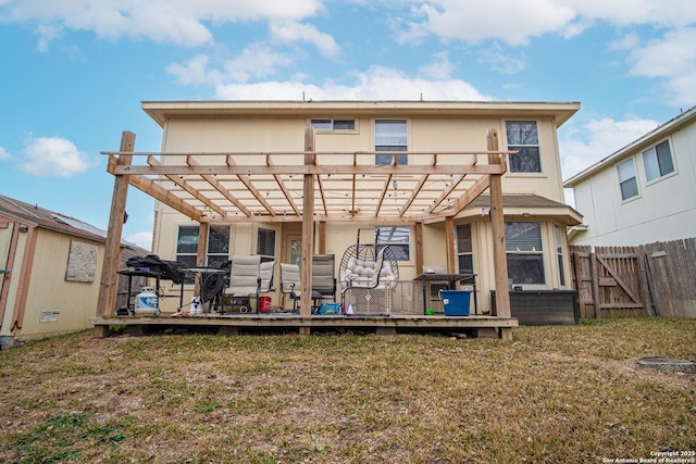 rear view of property featuring a lawn and a pergola