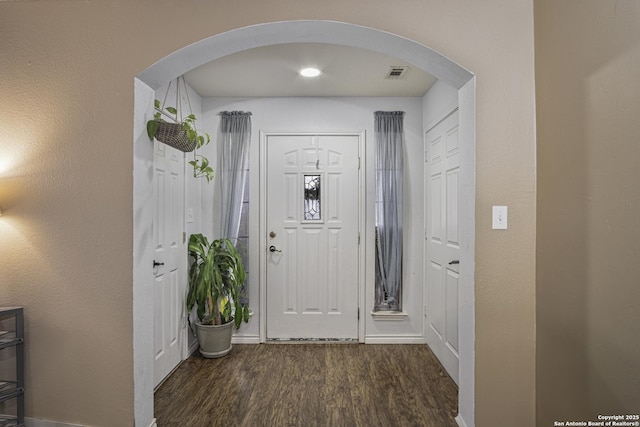 entryway with dark wood-type flooring