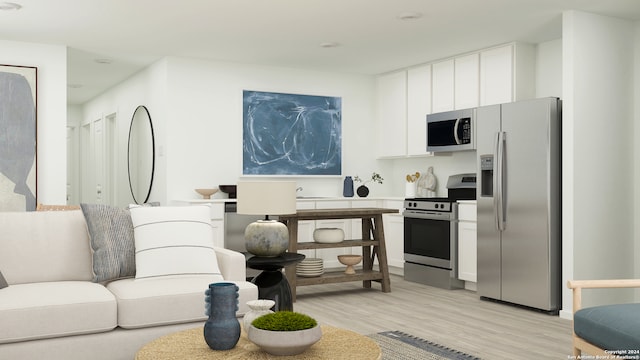 kitchen with stainless steel appliances, white cabinetry, and light wood-type flooring