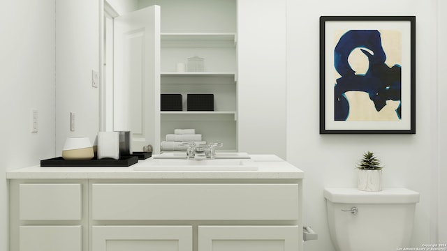 bathroom with vanity and toilet