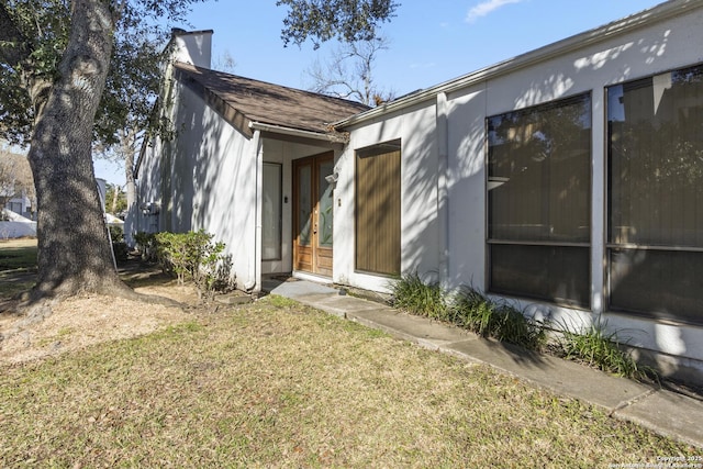 exterior space with a lawn