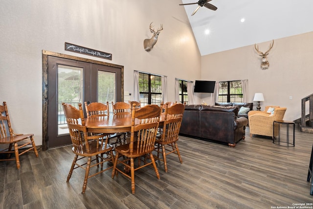 dining area with dark wood-type flooring, high vaulted ceiling, french doors, and ceiling fan