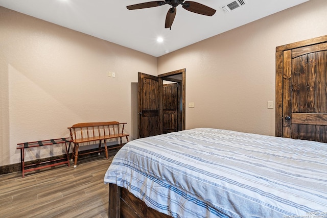 bedroom featuring hardwood / wood-style floors and ceiling fan