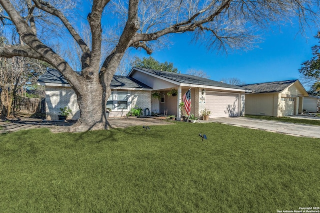 ranch-style home featuring a garage and a front yard