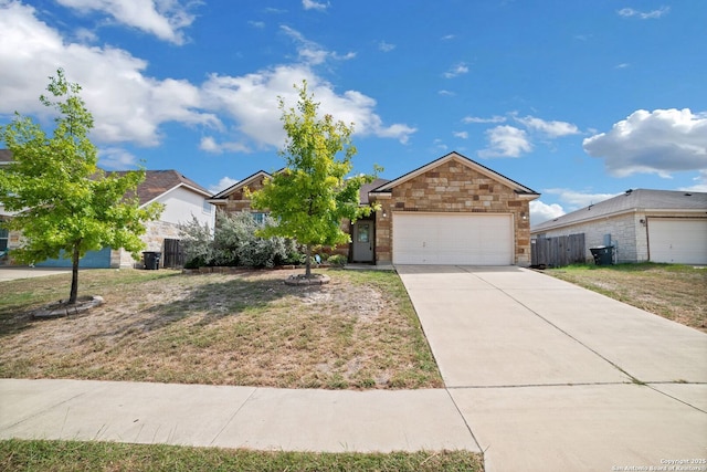 view of front of property with a garage and a front lawn