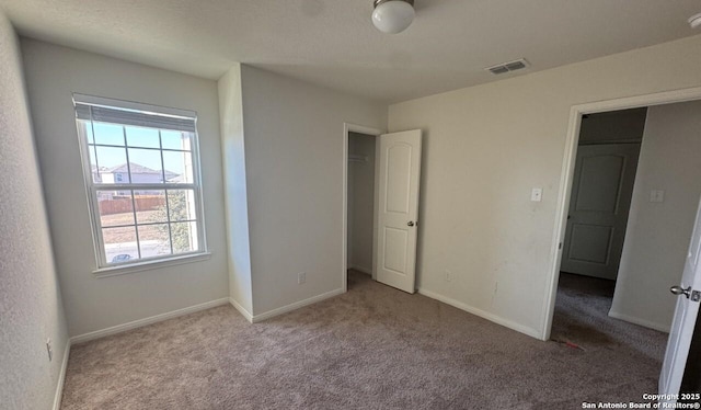 unfurnished bedroom featuring light colored carpet