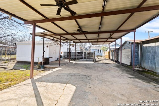 view of patio / terrace featuring ceiling fan and a shed