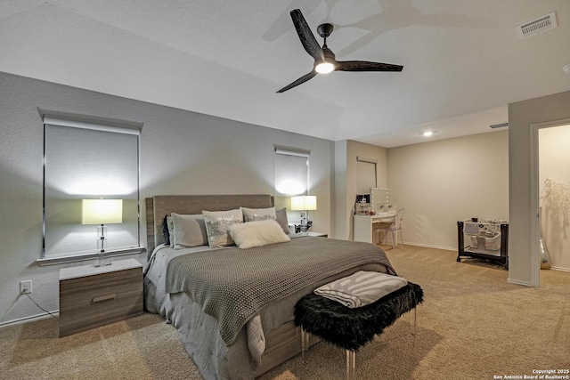 carpeted bedroom with ceiling fan