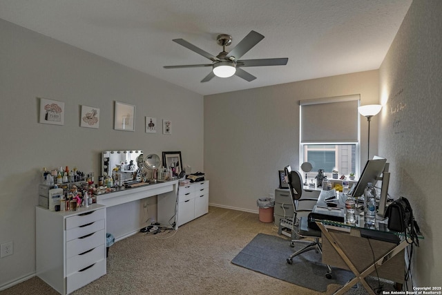 carpeted home office with ceiling fan