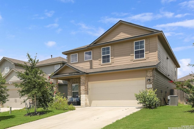 view of front of home featuring a garage, central AC unit, and a front lawn