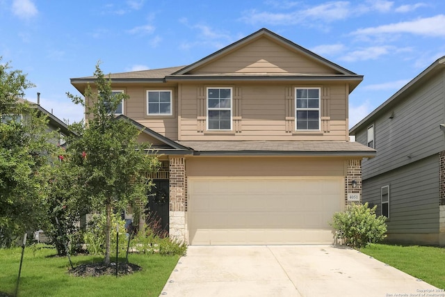 view of front facade with a garage and a front lawn