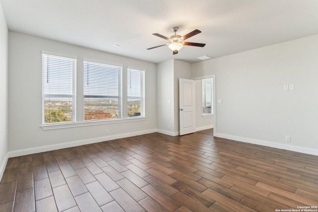 unfurnished room with dark hardwood / wood-style flooring and ceiling fan