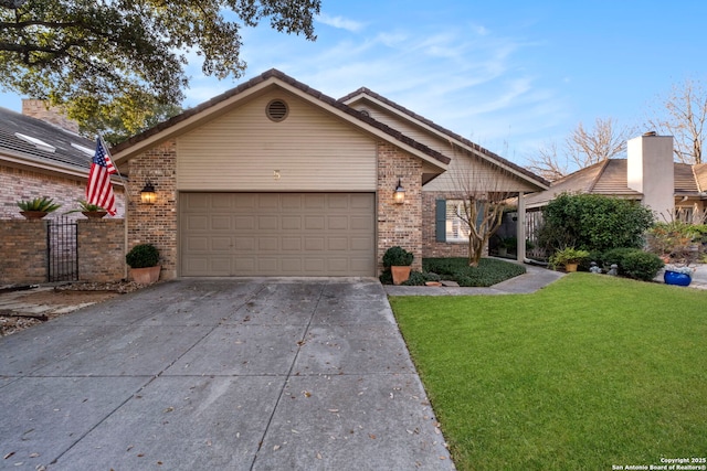 ranch-style home featuring a garage and a front yard