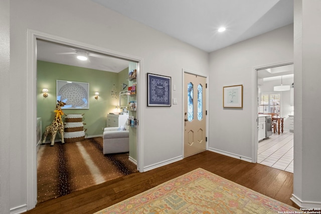 entryway with hardwood / wood-style flooring