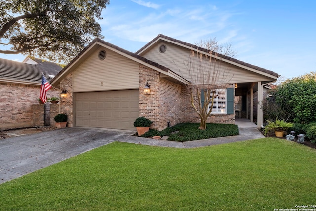 ranch-style house featuring a garage and a front yard