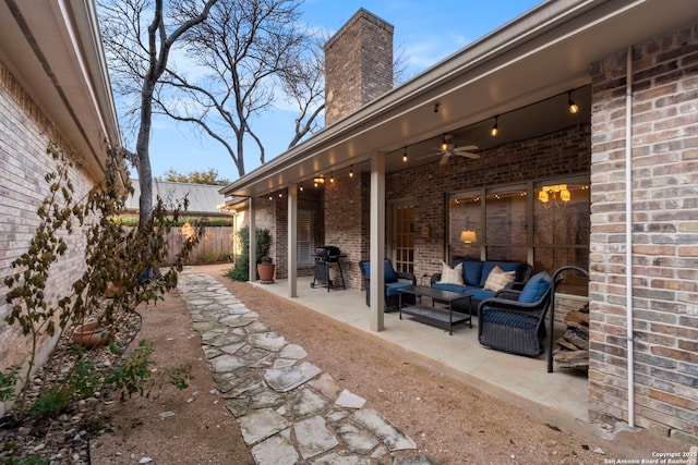 view of patio / terrace with an outdoor living space, grilling area, and ceiling fan