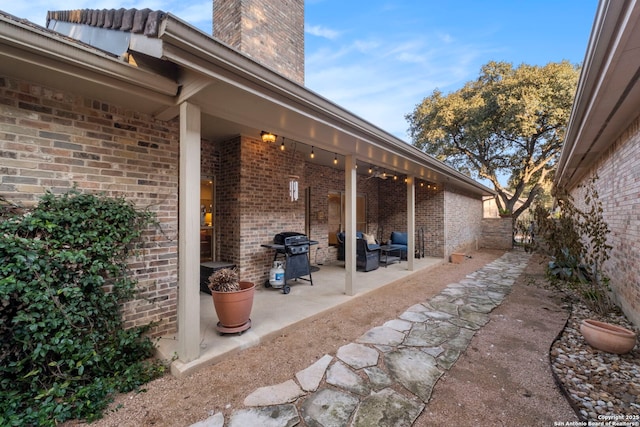 view of patio featuring a grill