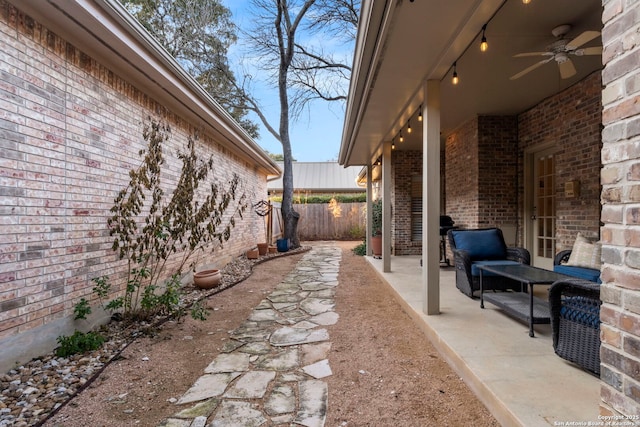 view of patio / terrace featuring ceiling fan