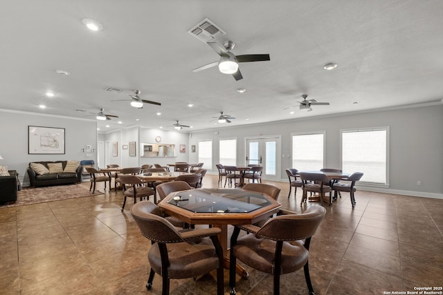 dining space featuring crown molding, tile patterned floors, and french doors