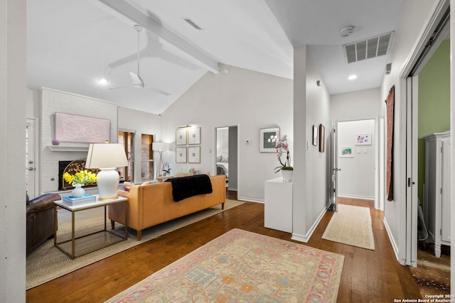 interior space featuring dark hardwood / wood-style flooring, beam ceiling, and high vaulted ceiling