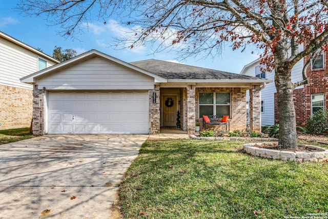 view of front of house featuring a garage and a front lawn