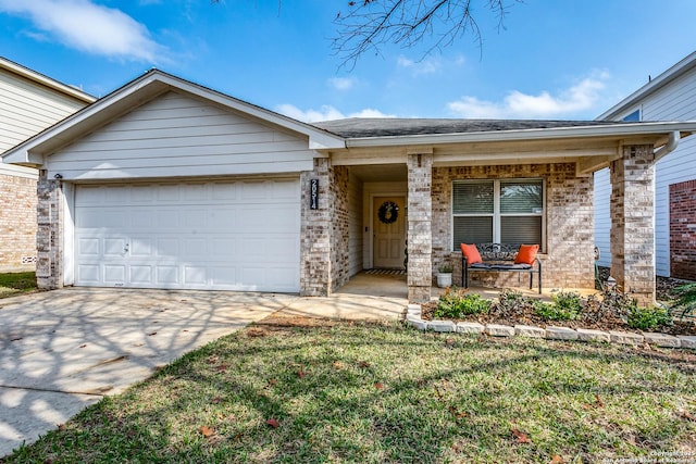 ranch-style house featuring a garage, a front yard, and covered porch