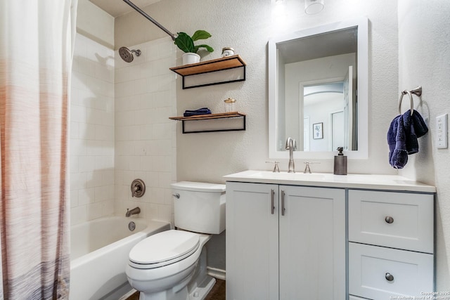 full bathroom with vanity, shower / tub combo with curtain, and toilet