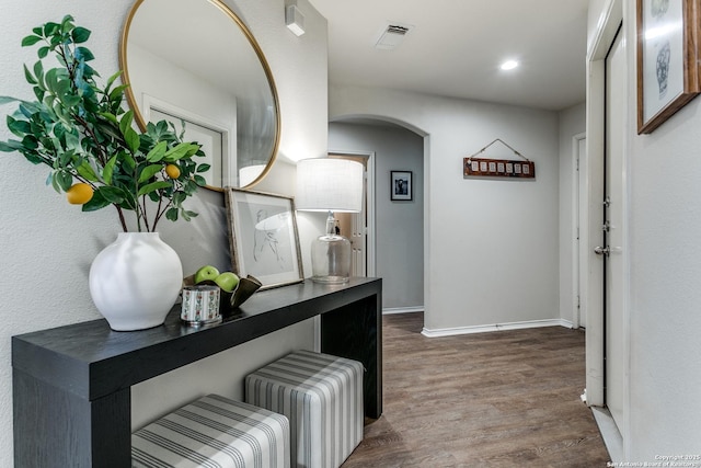 hallway with wood-type flooring