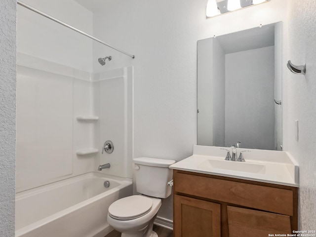 full bathroom featuring bathing tub / shower combination, vanity, and toilet
