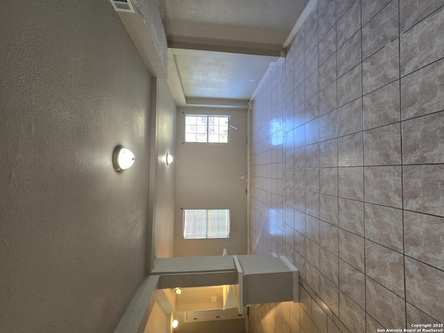 bathroom featuring tile walls