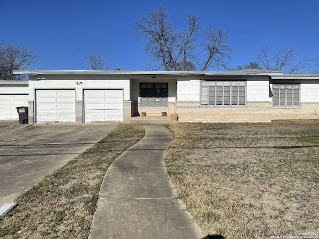 view of front of house with a garage and a front yard