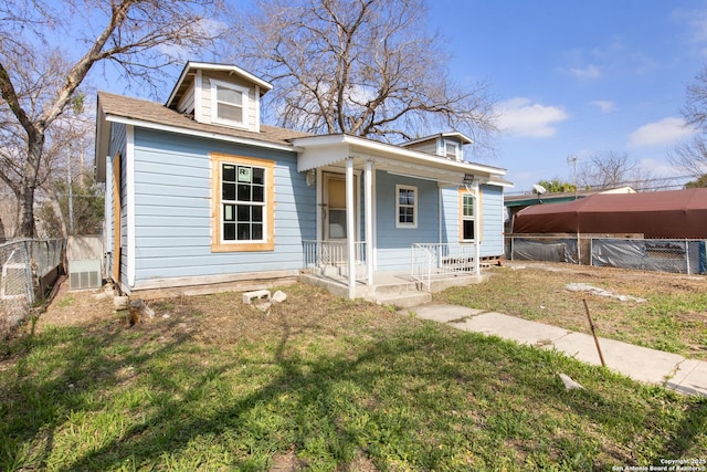 bungalow-style house featuring a porch and a front yard