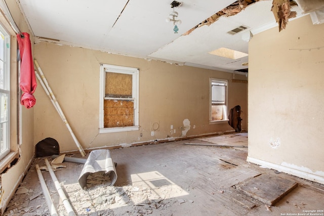 unfurnished room with plenty of natural light