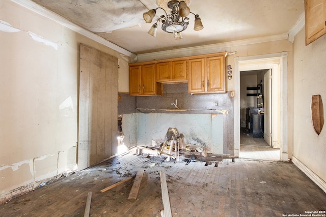 kitchen featuring ornamental molding and sink