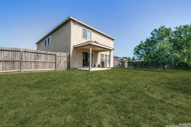 back of property featuring a patio area and a lawn