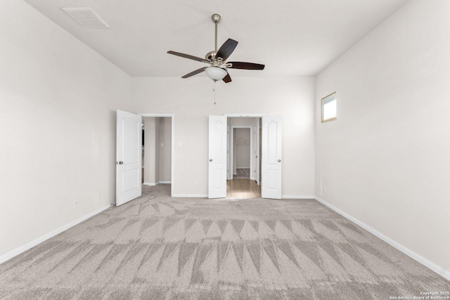 unfurnished bedroom with light carpet and ceiling fan