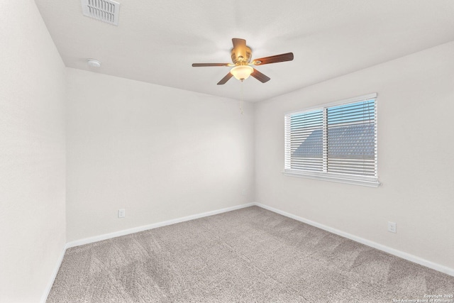 unfurnished room with ceiling fan and carpet flooring