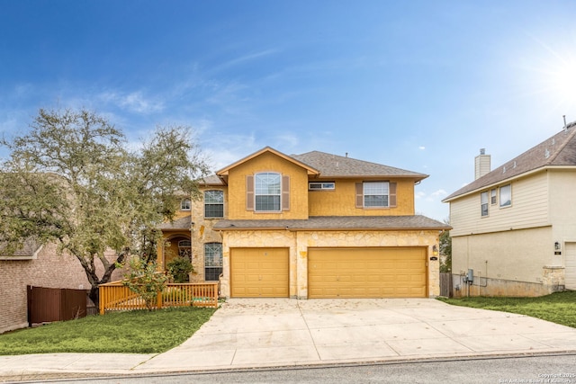 view of front of home featuring a garage and a front lawn