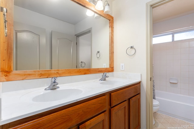 full bathroom featuring vanity, shower / tub combo, and toilet